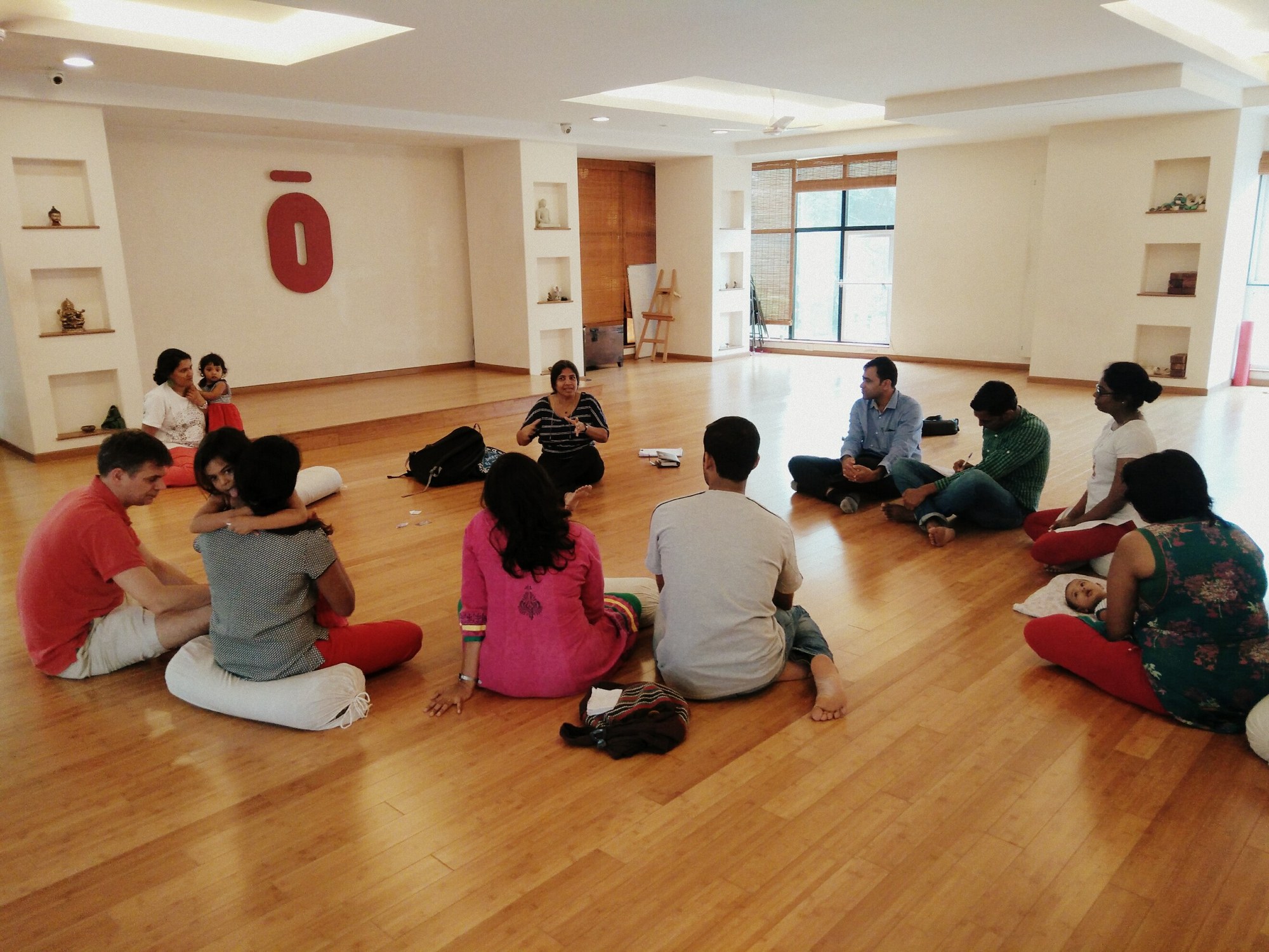 Parents seated in a circle during a childbirth education class