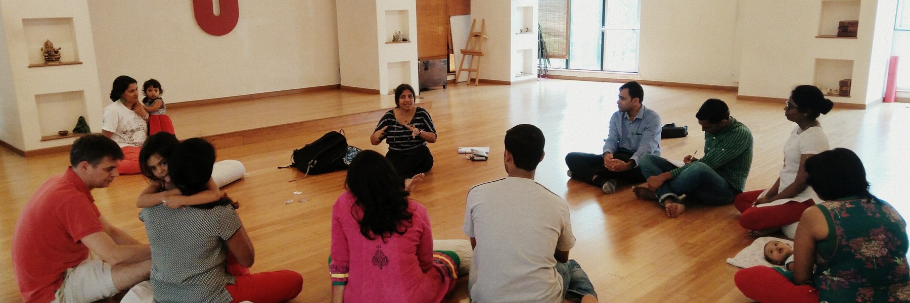 Parents seated in a circle during a Bangalore Birth Network childbirth class