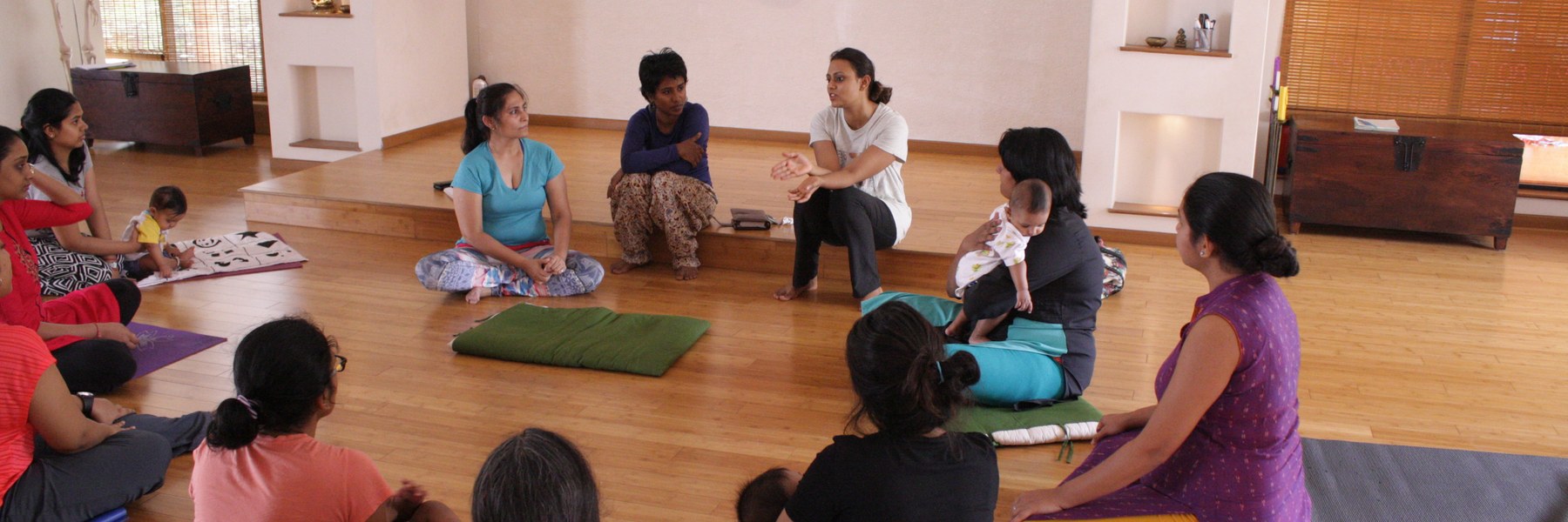 Mothers and babies in a movement and yoga class
