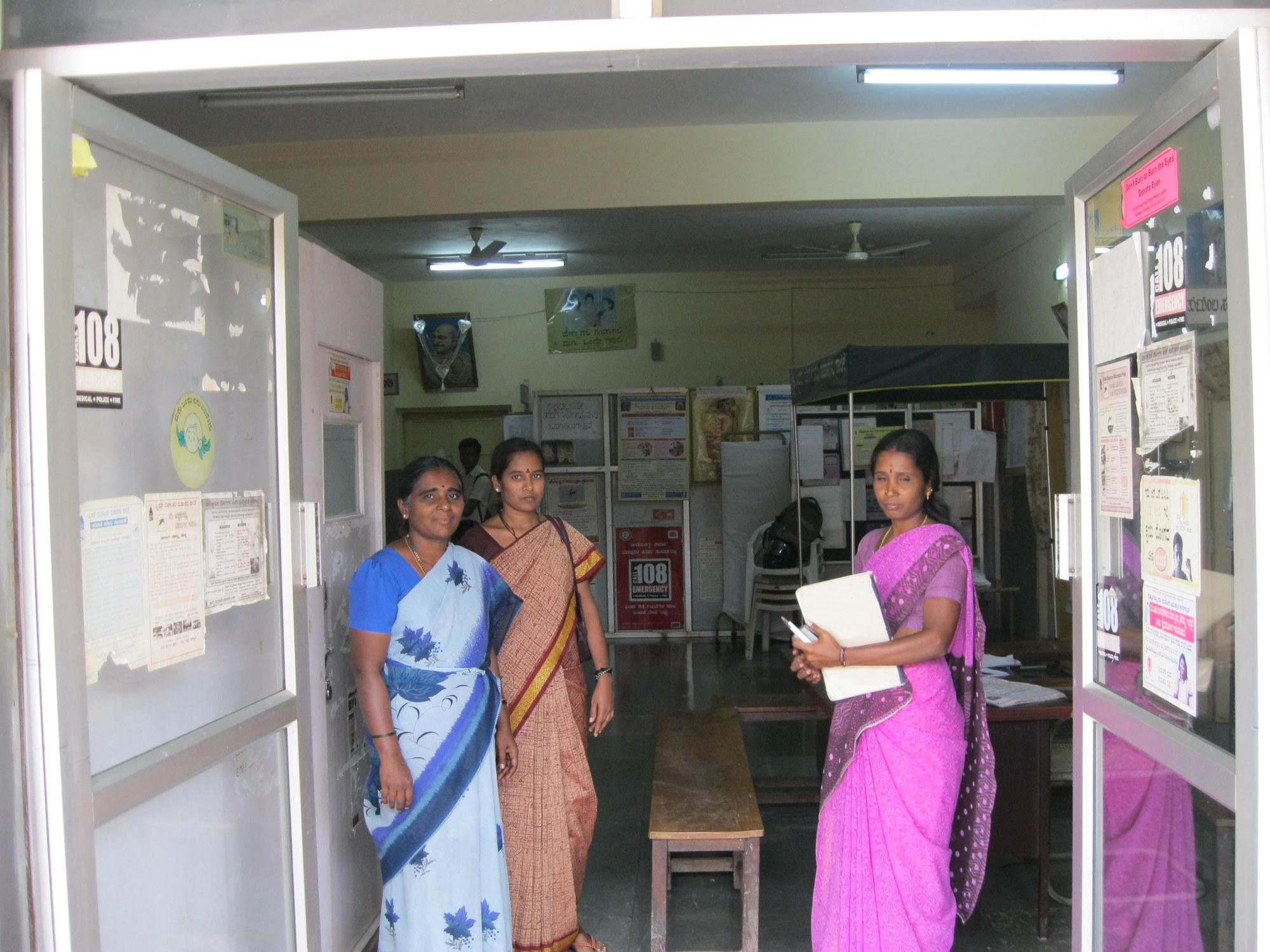 Health workers at the entrance of a primary health centre